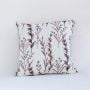 White cotton cushion cover with maroon botanical embroidery adding a vibrant nature inspired décor accent with a breathable soft and skin friendly material.