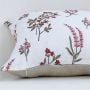Botanical printed cushion cover showing delicate red flowers leafy stems and smooth fabric texture for elegant interiors.