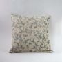 Floral embroidered cushion cover on white background - premium home decor pillow.