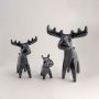 Set of black marble textured moose figurines styled together for elegant tabletop accents and modern home decor.