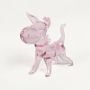 Pink glass dog figurine with glossy finish isolated on white background for cute and playful home decor display.