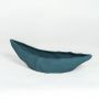 Teal ceramic decorative platter with angular sculpted design isolated on white background for contemporary home decor display.