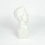 White resin bust sculpture with classical facial detailing isolated on clean white background for elegant home decor display.