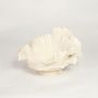 White ceramic ruffled decorative bowl with sculpted floral edges isolated on clean white background for elegant table decor styling.