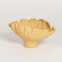 Yellow sagaform ceramic decorative bowl with ruffled fluted edges isolated on clean white background for modern tabletop decor styling.