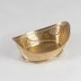 A golden decorative fruit basket with intricate cutwork design displayed on a clean white background highlighting its shape detailing and elegant elevated base.