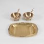 Two gold bowls with matching spoons and decorative gold tray shown separately on a plain white background.