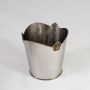 A silver metal dustbin with carved decorative detailing photographed on a white background showcasing its smooth finish and elegant curved top design.