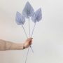 Light purple dried palm leaf displayed on white background for stylish vase decor and modern interior accents.