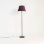 caelis linear black floor lamp with velvet shade purple light on white background