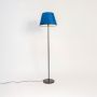 caelis linear black floor lamp with suede shade blue light on white background