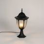 Tall black outdoor pillar lamp glowing with LED bulb and dome top clear glass design perfect for villa garden and patio.
