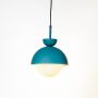Blue dome pendant ceiling light with frosted white globe glowing softly on clean white background for stylish modern interiors.