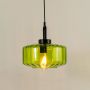 Green tinted glass pendant light with a faceted shade casting a warm radiant glow that brings a fresh contemporary accent and enriches the ambiance of the interior.