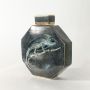 Octagon ceramic jar with green lizard artwork displayed on clean background for rustic natural décor.