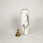 White ceramic tall decorative vase with black marble swirl pattern and gold lid ideal for floor styling and modern home decor.