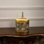 Decorative jar with floral design and gold top on plain white background highlighting elegant craftsmanship.