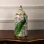 Artistic peacock-themed ceramic jar with rich green tones and classic gold detailing ideal for modern or traditional interiors.