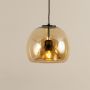 Modern amber glass hanging light with curved dome shade and black metal rod displayed on a clean white background for clear product detailing.