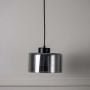 Contemporary smoked glass pendant light with black detail modern design ceiling lamp for bedroom dining and living room interiors.