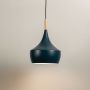 Colorful pendant light with soft illumination on a clean white background highlighting its design.
