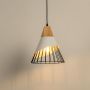 White pendant light with black wire cage and wooden top glowing against a neutral white background.