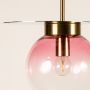 Close view of pink glass pendant light showing smooth gradient finish metallic gold accent and refined artistic detailing.
