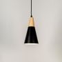 Pendant light glowing on white background with conical black metal shade and natural wooden top for modern interiors.