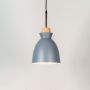 Grey pendant ceiling light with wood top illuminated on white background for stylish home dining and living room lighting.