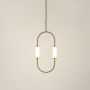 lluminated oval brass pendant lamp with glowing white cylinder shades on clean white background for product display.
