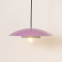 Lavender metal pendant light glowing softly on white background for stylish kitchen dining and living room home decor.