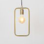 Pendant light turned on against white background showing warm glow from exposed bulb with sleek metal frame design.