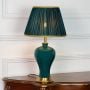 Teal ceramic table lamp featuring smooth glazed finish gold metal base and pleated fabric shade displayed on white background.