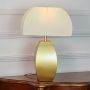 Gold metal table lamp featuring satin finish curved base and frosted glass shade displayed cleanly on white background.
