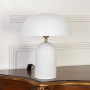 Table lamp placed on white background without light revealing clean rounded shade smooth matte body and compact base ideal for modern decor styling.