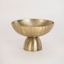 Elegant gold bowl with hammered finish shown in natural setting without white background for warm styled look.