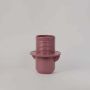 Matte pink ceramic flower vase with round base and ribbed upper body ideal for living room or dining table decor.