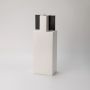 White ceramic vase with black top minimal rectangular design displayed on white background for modern home styling.