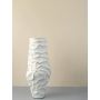 Detailed closeup of white ceramic vase showing embossed abstract texture for elegant home decor accents.