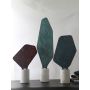 Ourea decorative sculptures grouped together with marble bases and green stone textures for modern luxury home interiors.