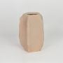 Beige decorative ceramic flower vase isolated on white background modern sculpted vase for home decor styling.