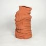 contour wave ceramic vase rust orange white background 1