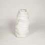 White ceramic abstract sculpted wave vase ideal for dried flower arrangement in living room corner console table and contemporary home decor.