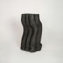 Black ceramic sculpted decorative floor vase ideal for dried flower arrangement in living room corner console styling and modern home decor.