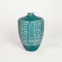 Teal green ceramic decorative vase with white geometric pattern perfect for living room console table or shelf styling.