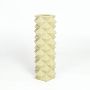 Modern yellow ceramic vase with 3D geometric diamond texture isolated on clean white background.