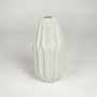 White ceramic flower vase with vertical sculpted design isolated on clean white background for contemporary home decor display.