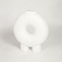 Modern white ceramic donut vase with hollow center design perfect for living room console table or shelf decor styling.