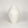 White ceramic decorative floor vase with textured sculpted surface ideal for dried flower arrangement and contemporary home decor styling.