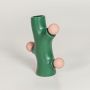 Green ceramic decorative vase with pink spherical accents perfect for modern living room console table or shelf decor styling.